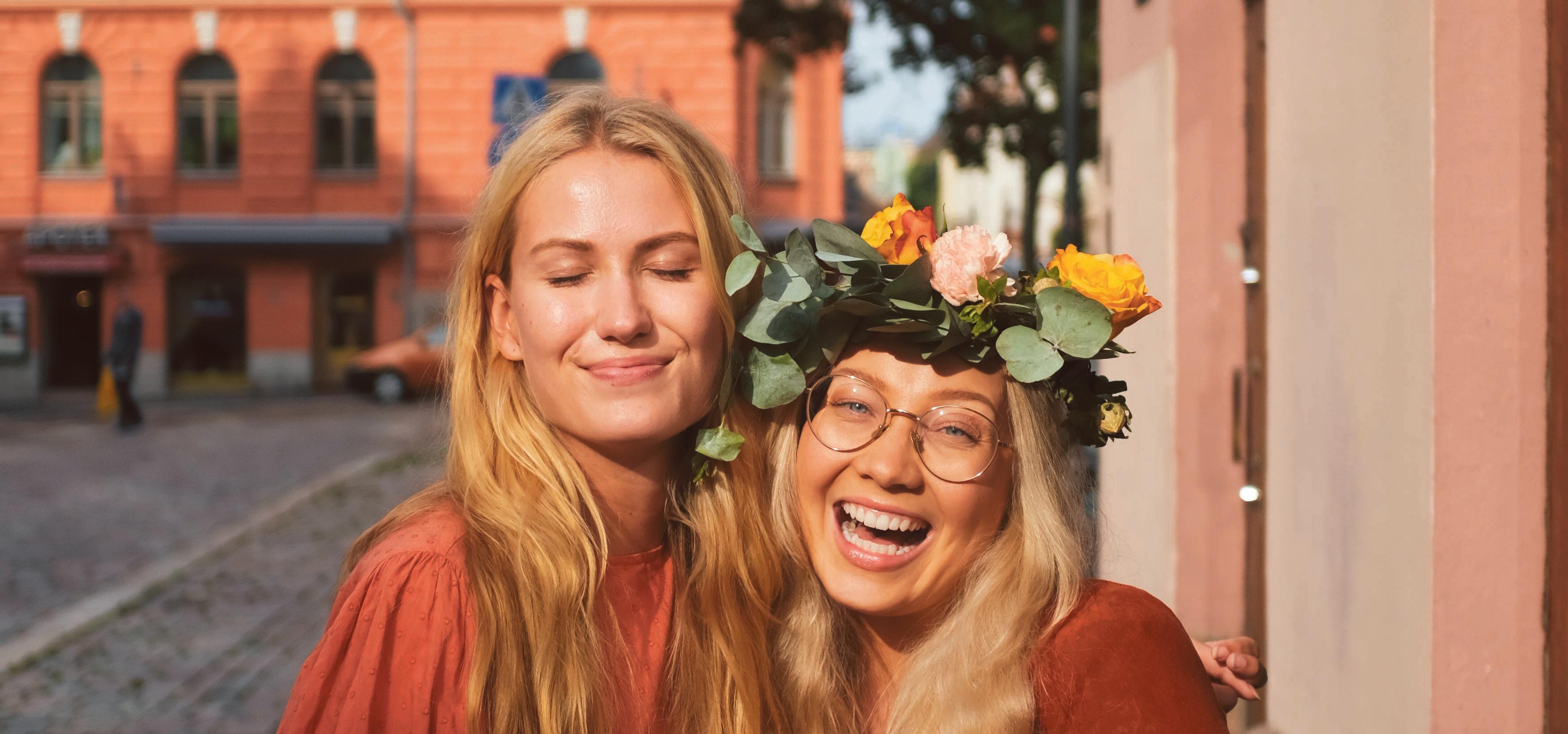 Happy women smiling at the camera.